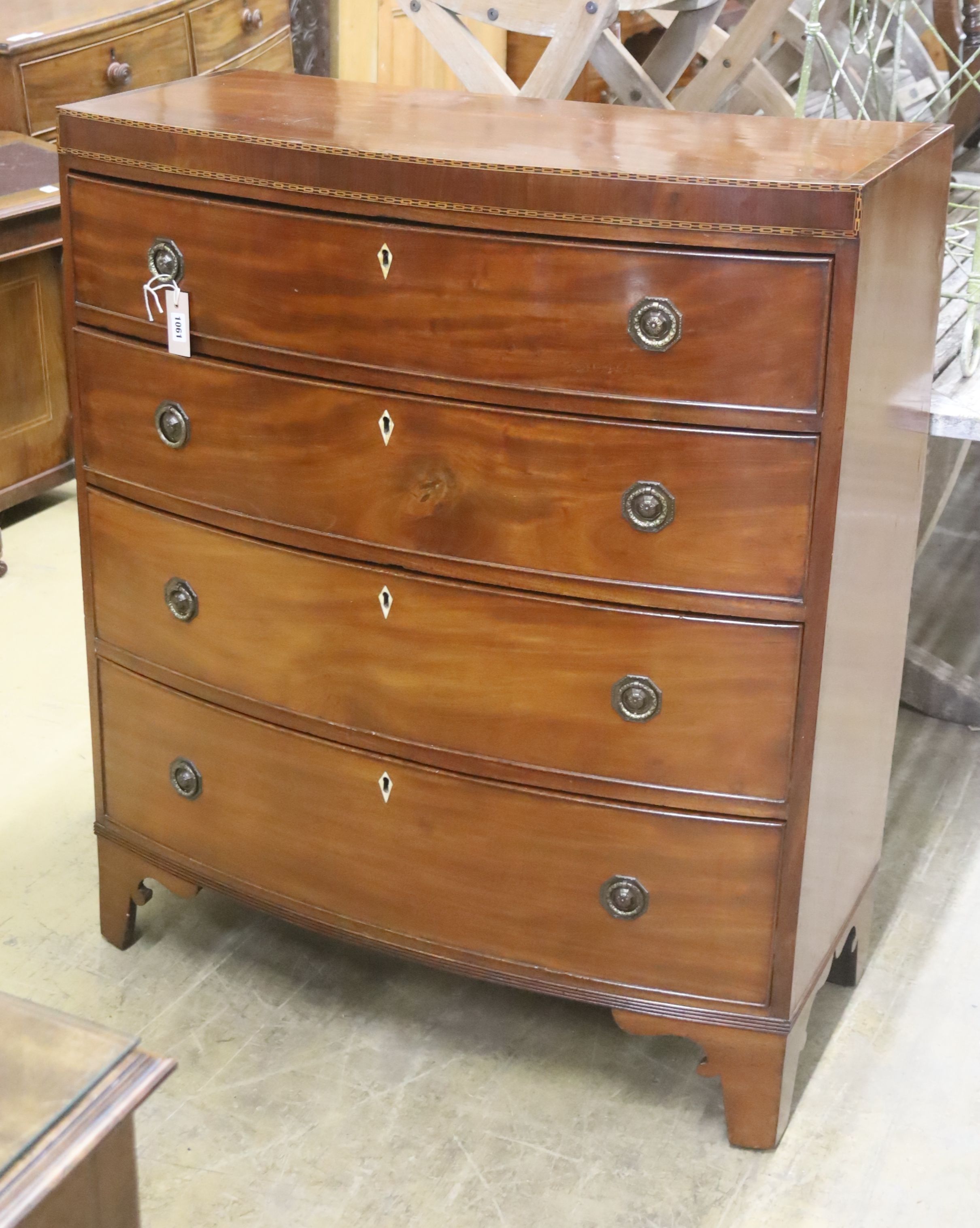 A Regency banded mahogany bowfront chest of drawers, width 92cm, depth 45cm, height 109cm